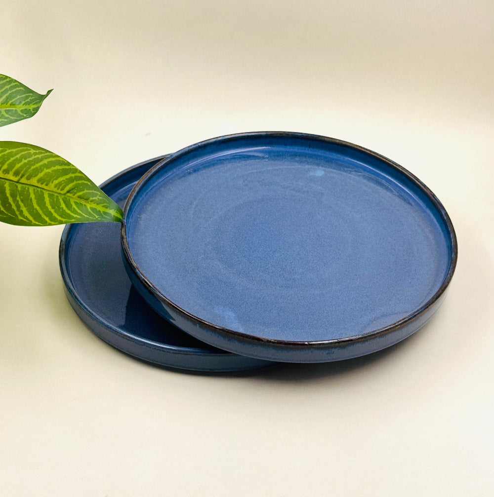 Set of 2 romantic ceramic flat plates with soft curves and warm glaze