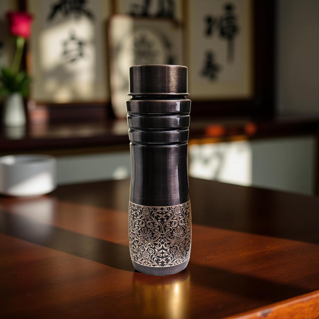 Decorative bottle with intricate design on a wooden surface