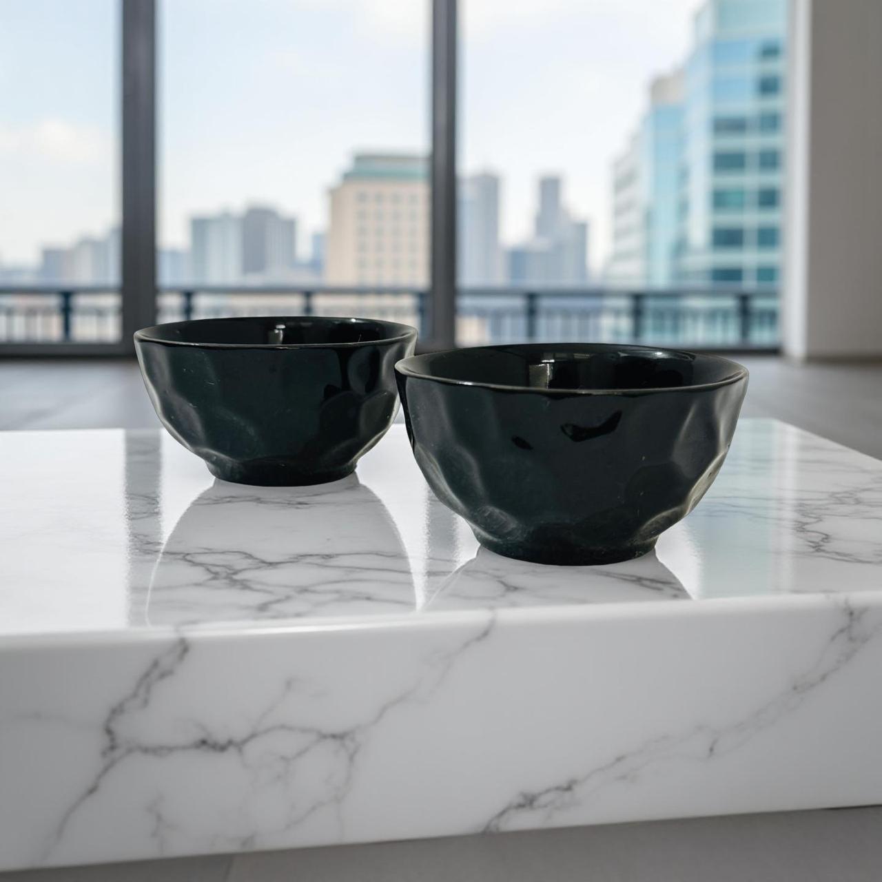 Set of 2 black textured ceramic bowls with soft gloss finish for everyday serveware