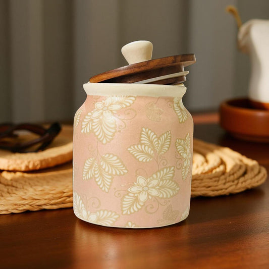 Ceramic jar with floral pattern on a wooden surface