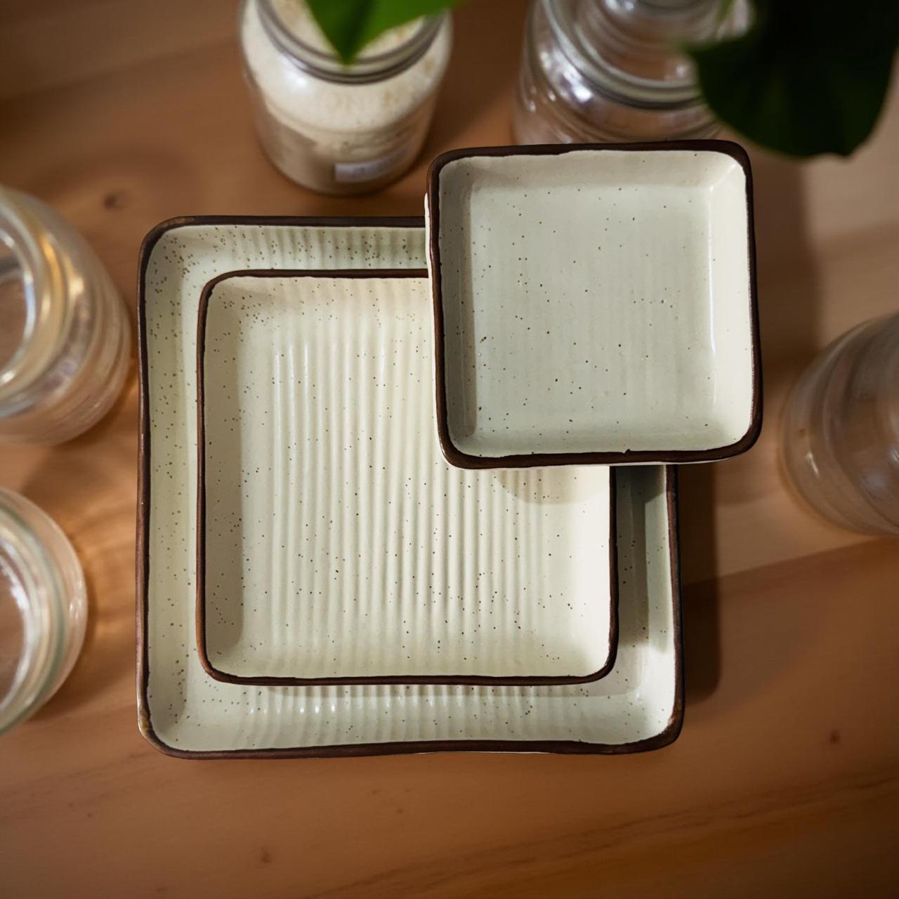 Square ceramic dish with textured surface on a wooden surface