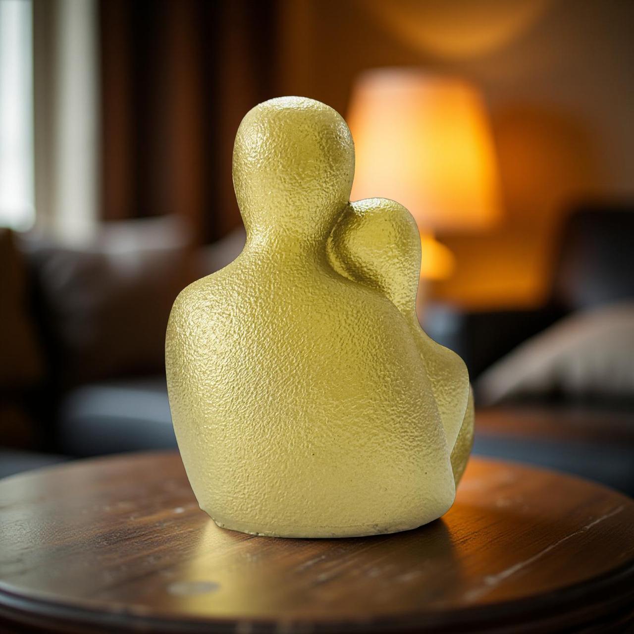 Yellow textured sculpture on a wooden table with a blurred indoor background