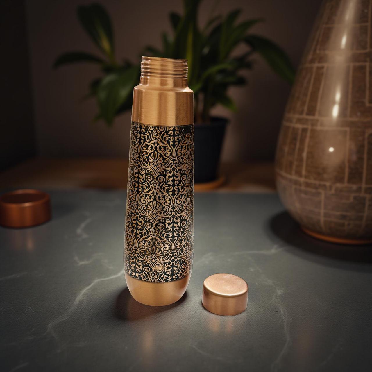 Decorative bottle with intricate design on a dark surface