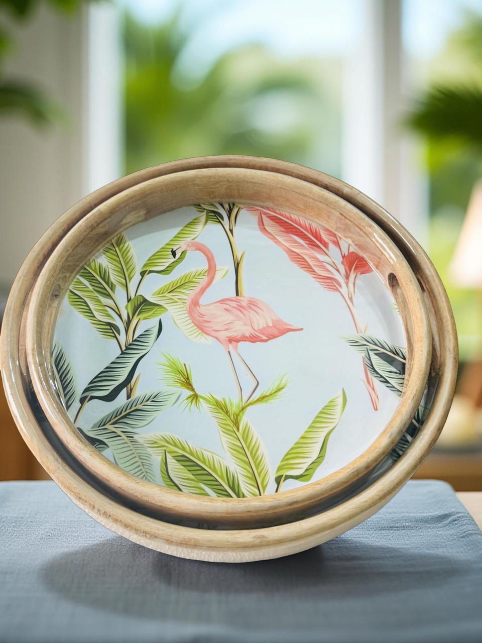 Decorative plate with flamingo and leaf design on a wooden frame