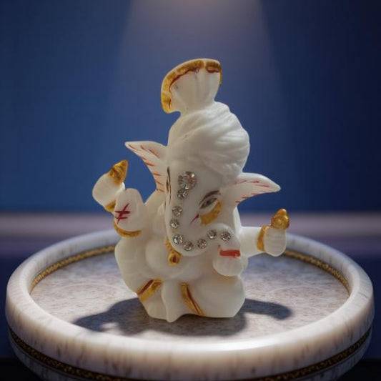 Decorative statue of ganeshji on a circular platform with a blue background