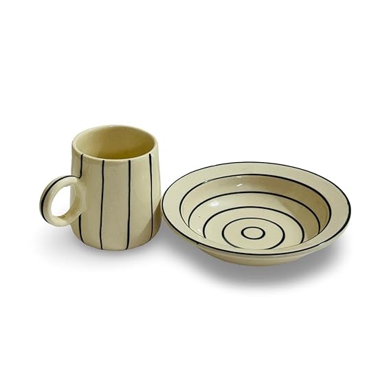 Ceramic mug and bowl set with black striped design on a white background