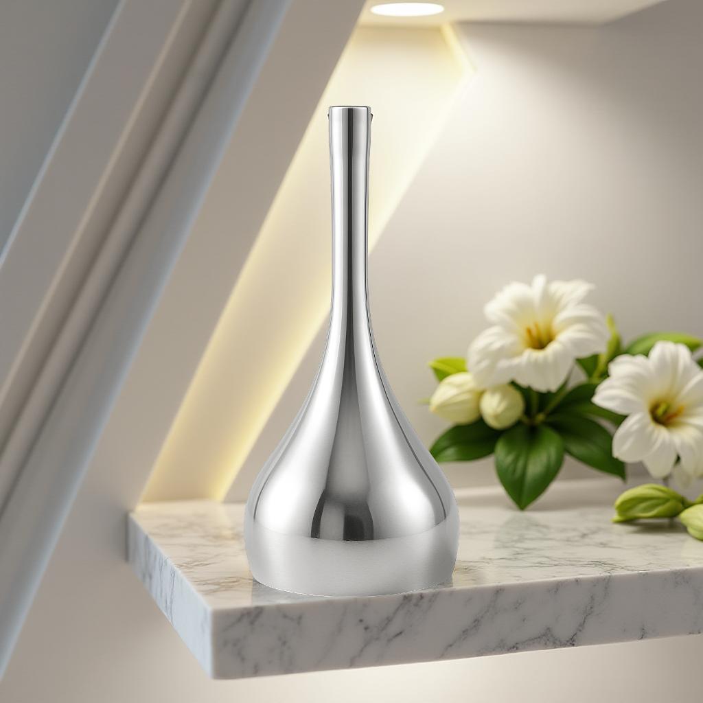 Silver bell on a marble shelf with white flowers in the background