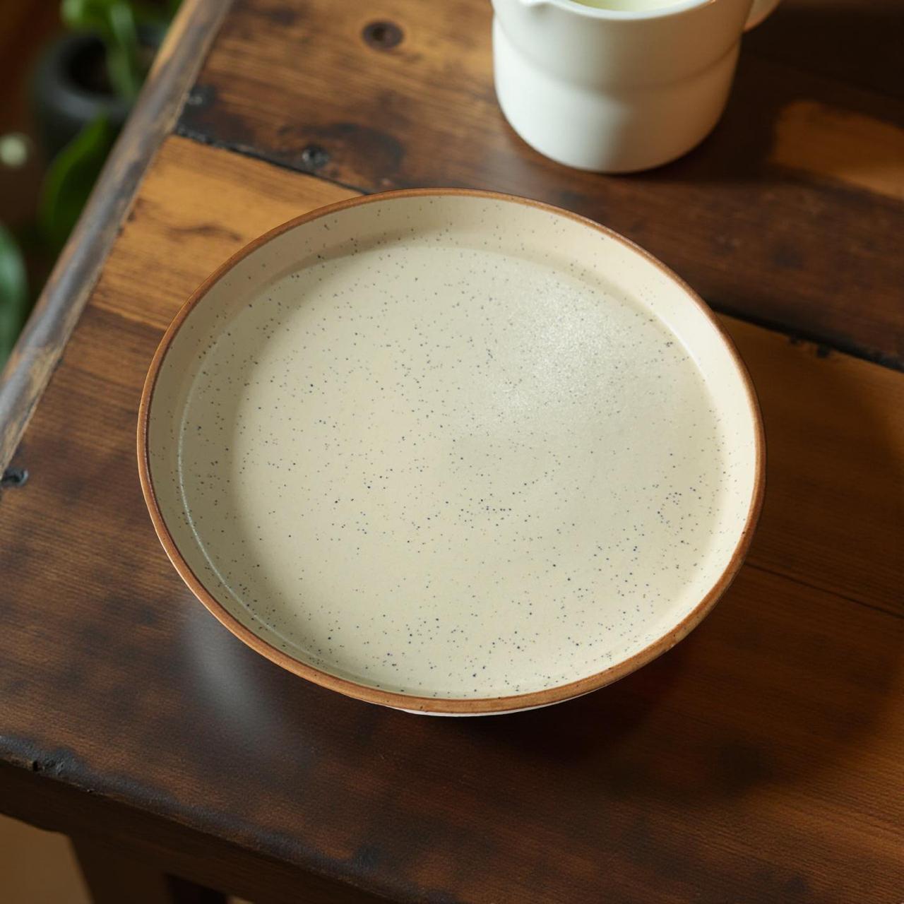 Ceramic bowl on a wooden surface with a blurred background