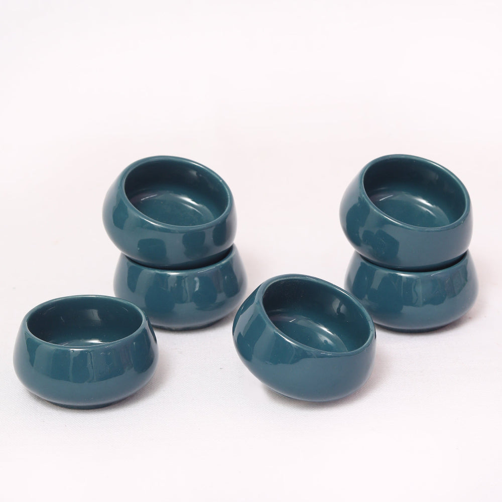 Colorful street-food dip bowls filled with mint and tamarind chutneys