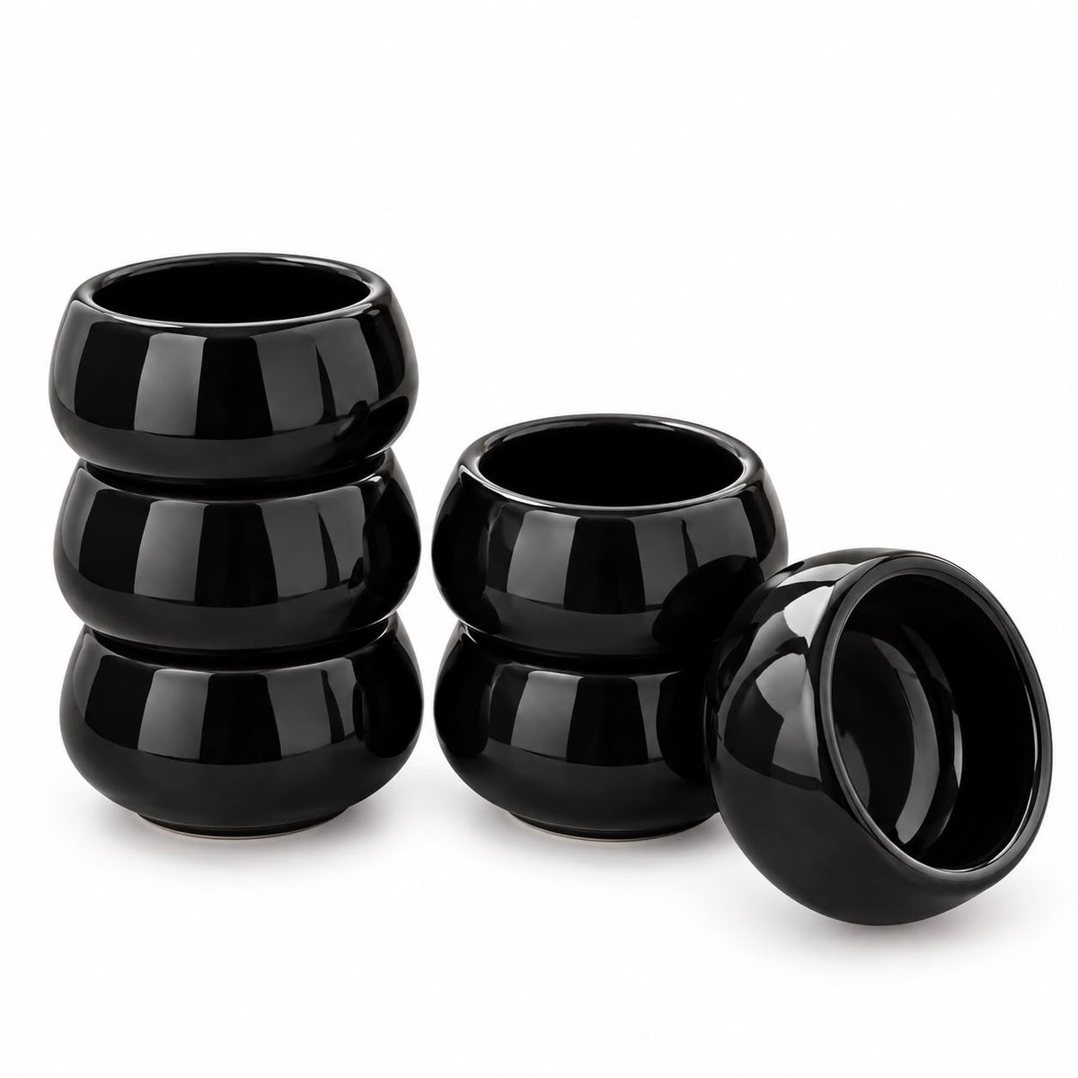Lupaava black ceramic serving bowls featuring a rounded design for contemporary dining and kitchen tableware.
