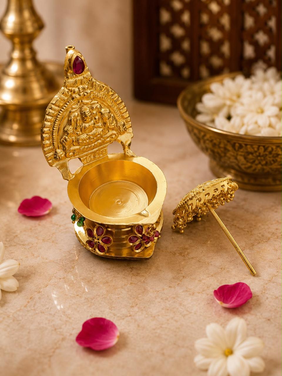 Bring home the warmth of tradition and the sparkle of celebration with this exquisitely designed decorative diya featuring an ornate Devi-inspired motif and detachable hanging top