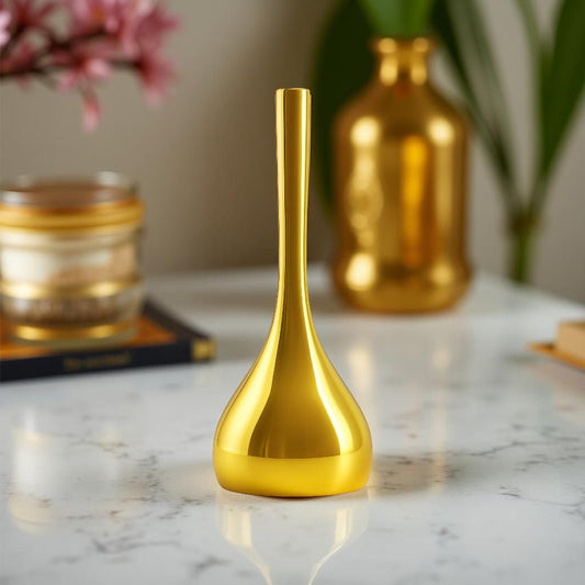 Gold pooja bell for temple on a marble surface with a blurred background