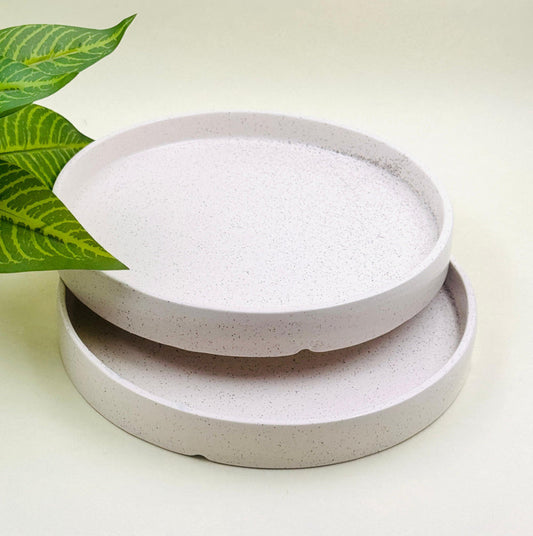 Handcrafted ceramic flat plate with rustic glaze on linen tablecloth