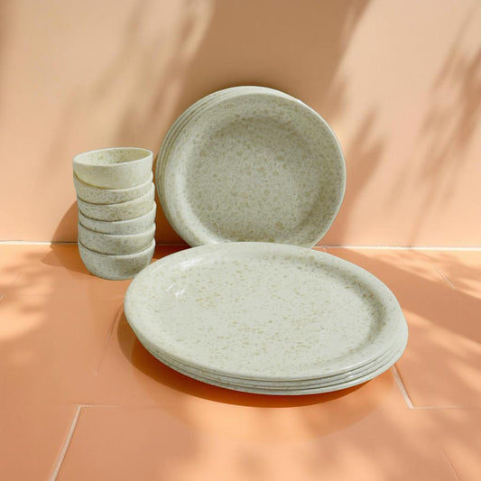Off-white 14-piece melamine dinner set with marble effect finish