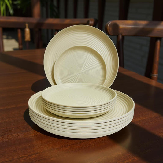 Set of melamine beige plates on a wooden table