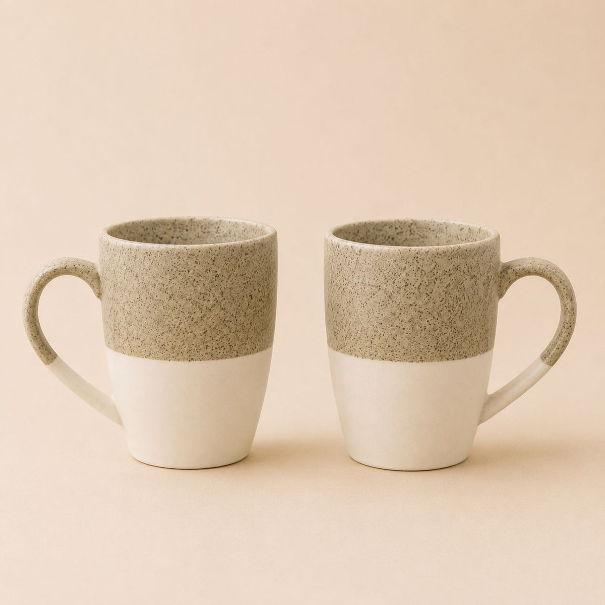 Minimalist two-tone ceramic coffee mug set with modern speckled texture