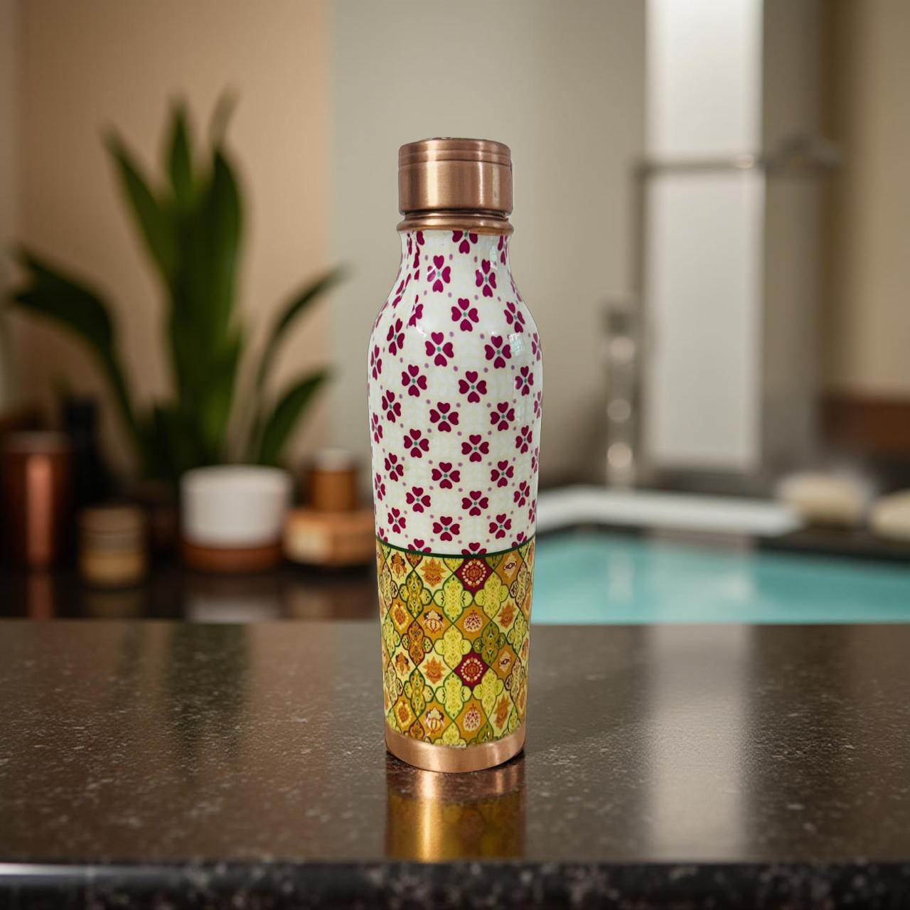 Patterned water bottle on a kitchen counter with blurred background