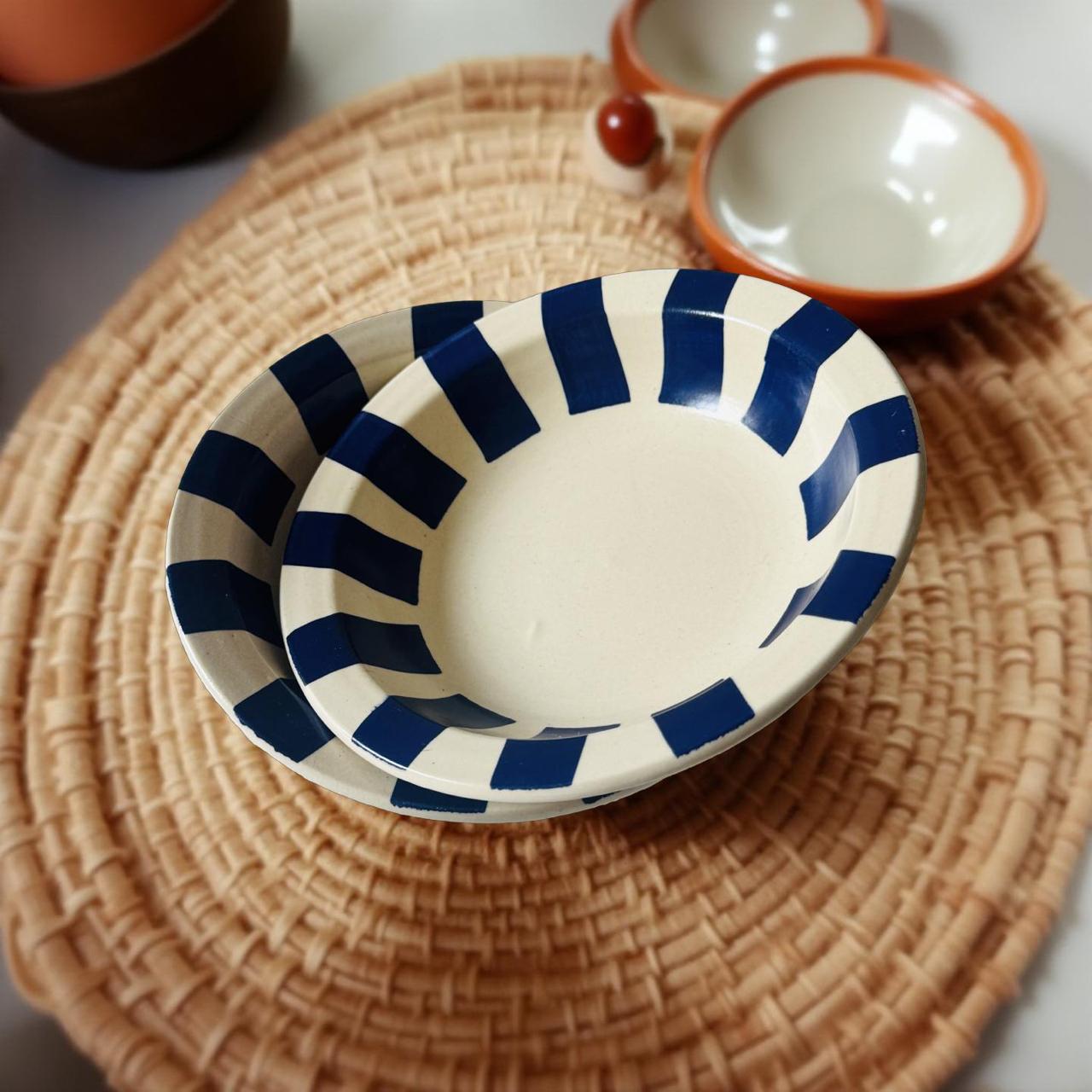 Ceramic bowl with blue stripes on a woven mat