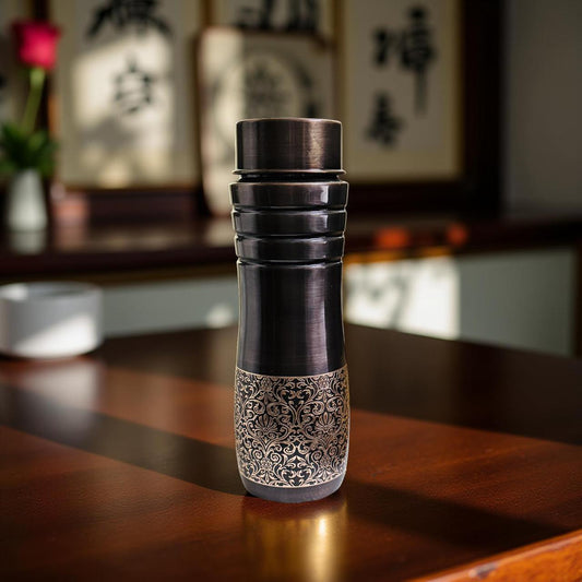 Decorative bottle with intricate design on a wooden surface