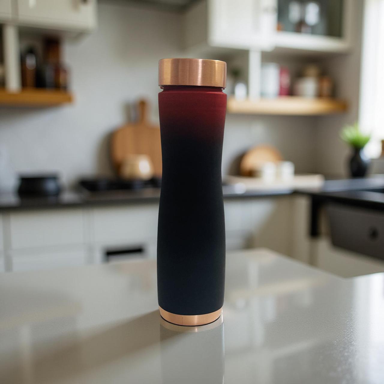 Black and rose gold insulated bottle on a kitchen counter