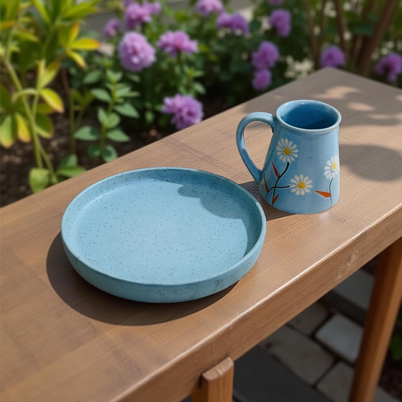 Blue speckled ceramic plate with floral mug on window ledge – perfect solo dining set for bachelors, hostelers, and office-goers.