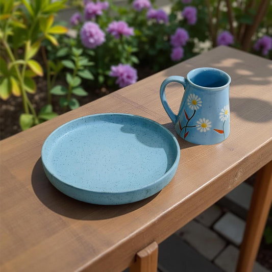 Blue speckled ceramic plate with floral mug on window ledge – perfect solo dining set for bachelors, hostelers, and office-goers.