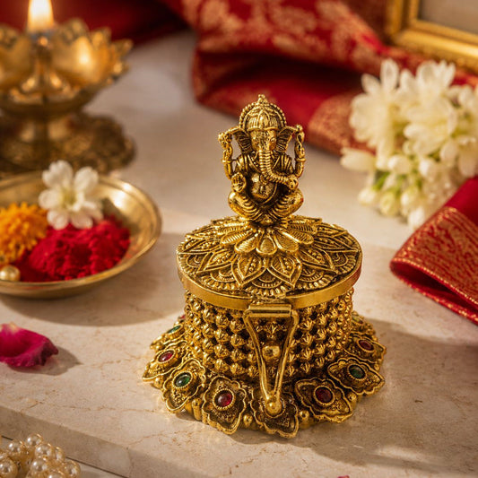Exquisite handcrafted brass kumkum box featuring detailed Lord Ganesha idol artistry