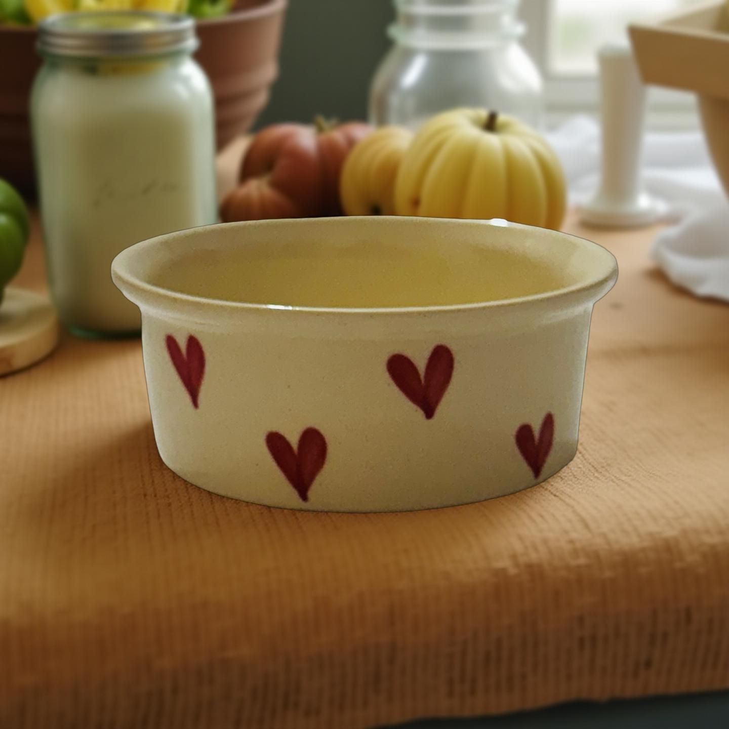 Ceramic dish with heart patterns on a wooden surface