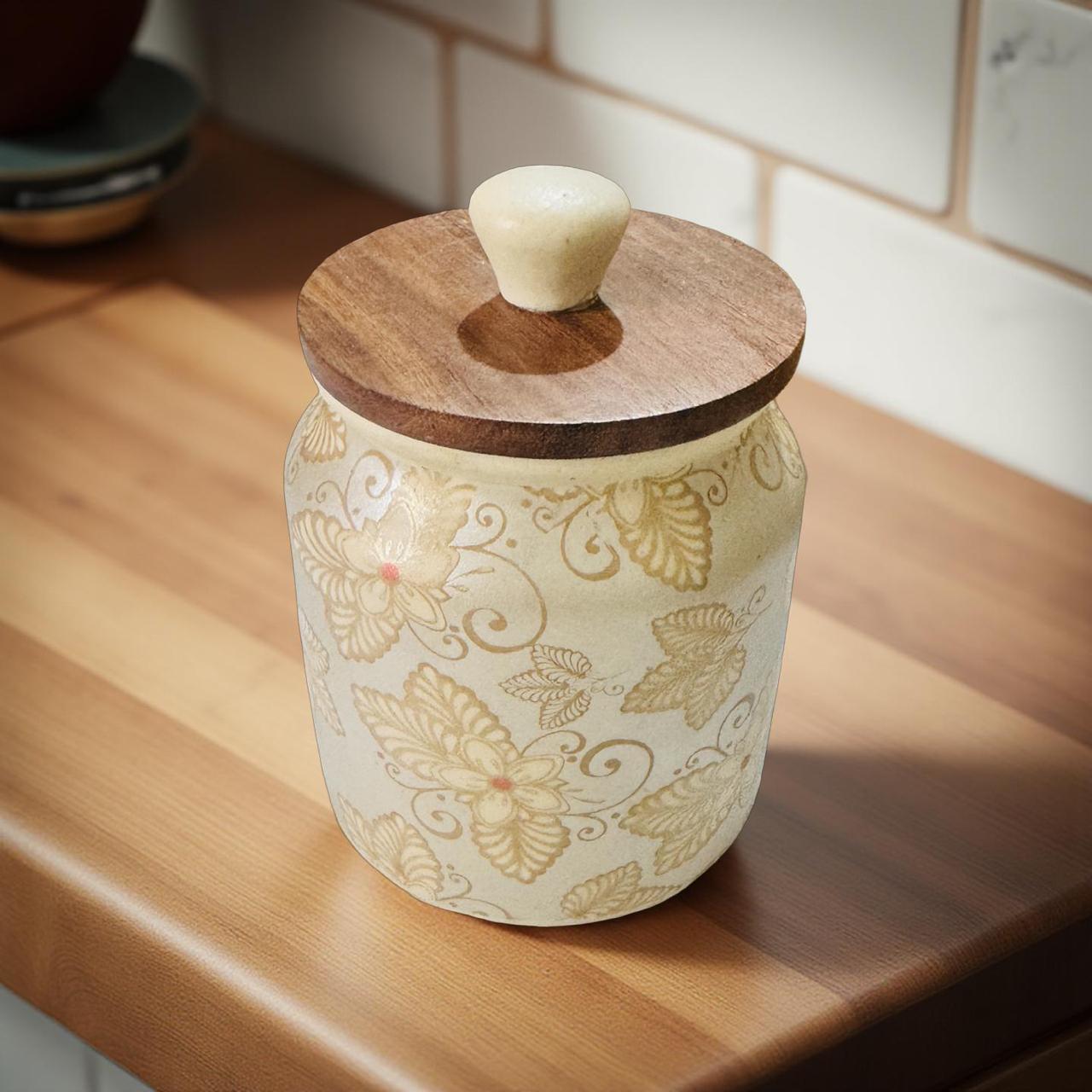 Elegant handcrafted ceramic jars in soft pastel tones with wooden tops, perfect for kitchen storage and home decor.