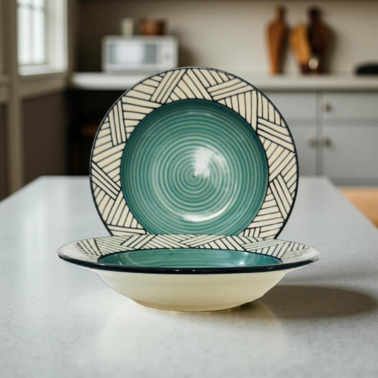 Ceramic bowl and plate set with green and beige pattern on a kitchen counter.
