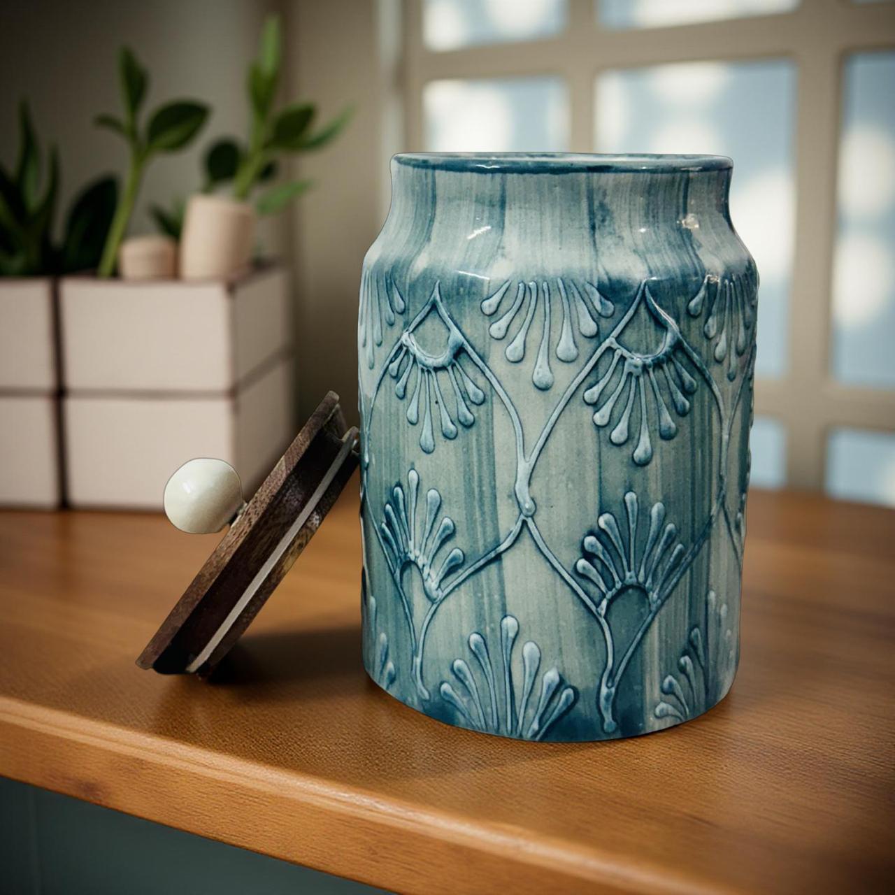 Designer blue ceramic canister with embossed pattern used for tea coffee storage