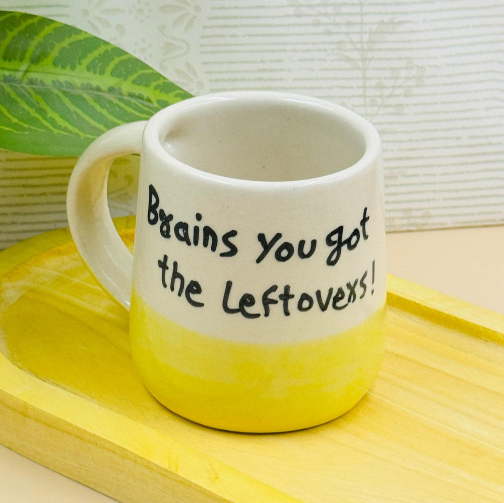 White ceramic mug with black quote: “Brains? You Got the Leftovers” – 250 ml, clean and modern style