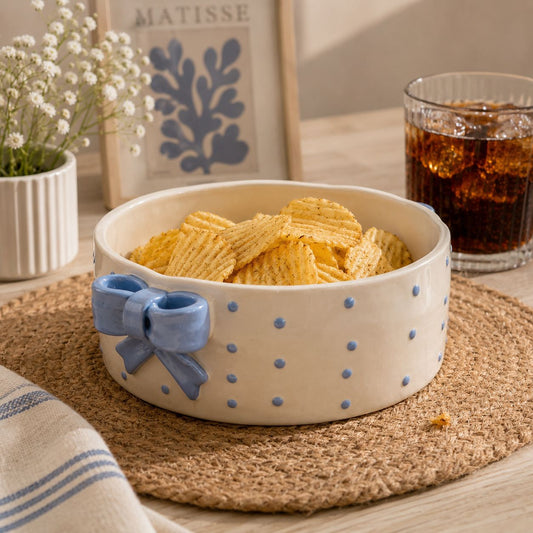 Elegant handcrafted ceramic bowl with trendy blue bow design and scalloped edges