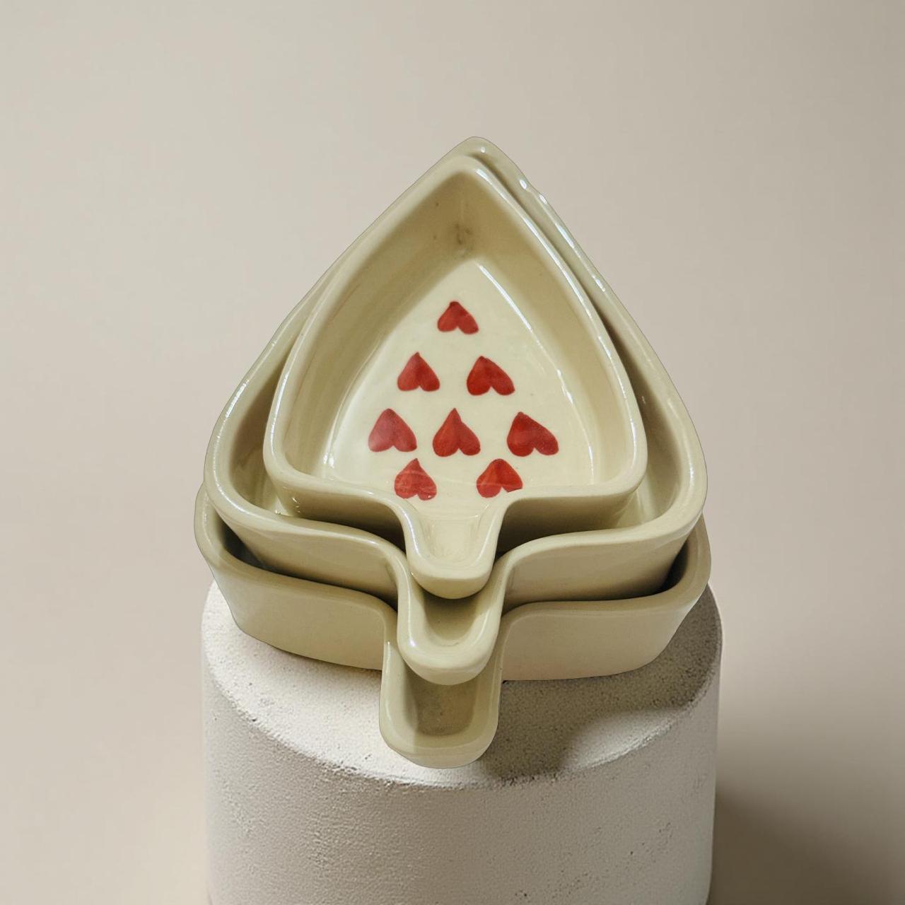 heart design stackable bowl set kept on a concrete block