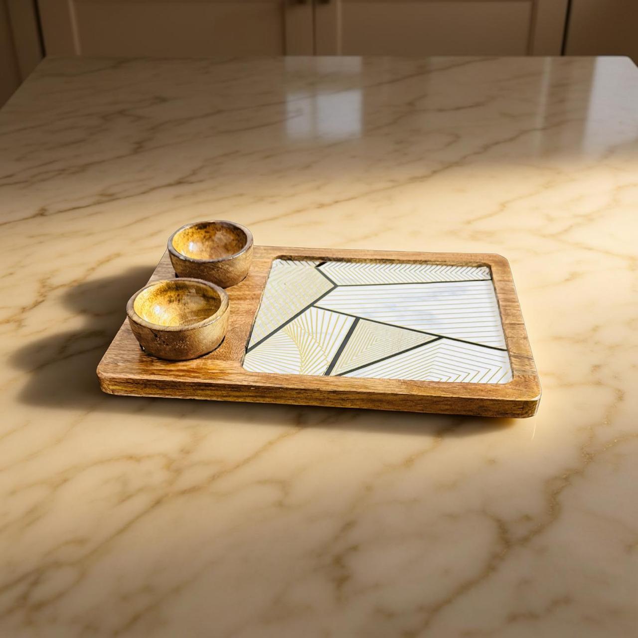 Wooden tray with two small bowls on a marble surface