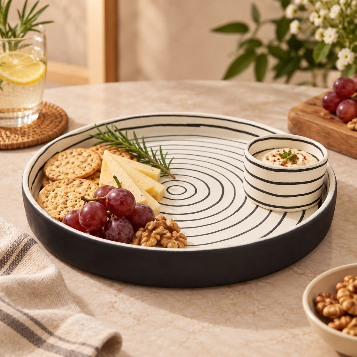 Ceramic serving platter with attached dip bowl