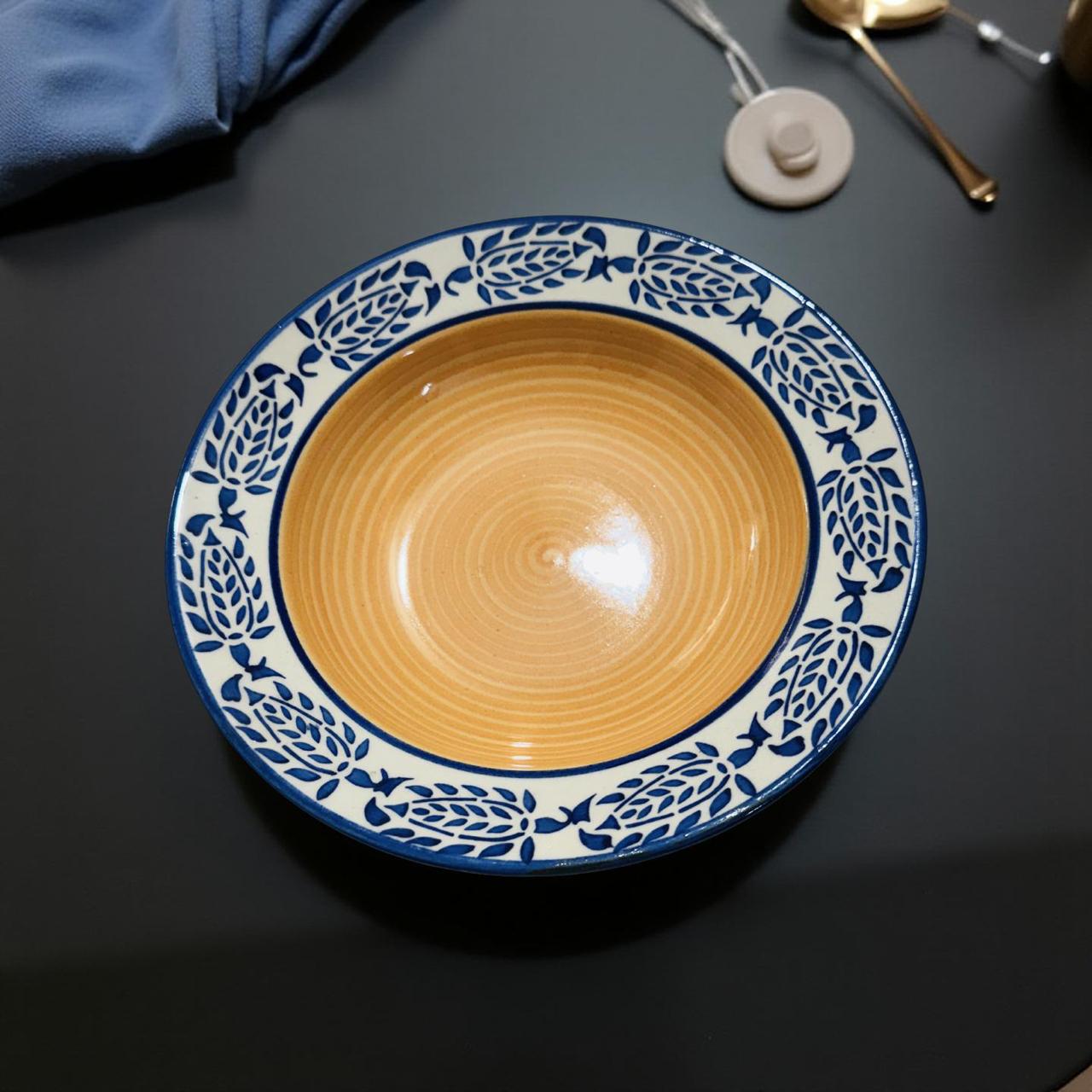 Ceramic bowl with blue decorative rim on a dark surface