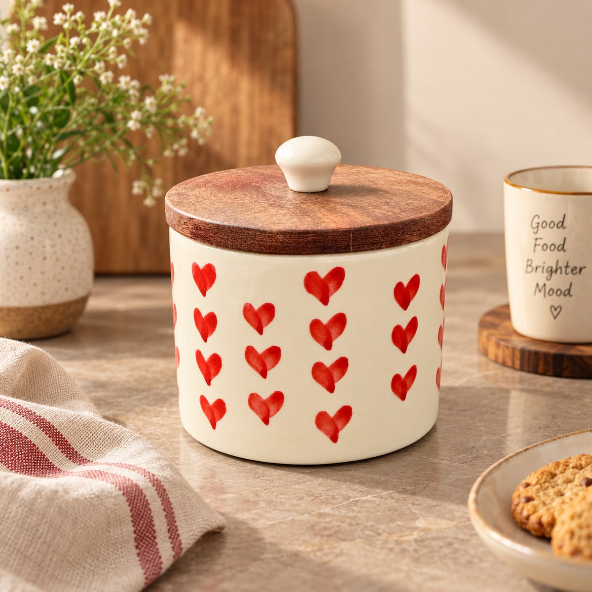Ivory ceramic treat canister with red heart pattern