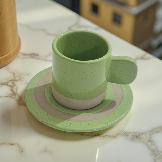 Pastel green ceramic espresso cup with saucer – minimalist artisan mug set by Lupaava on marble table