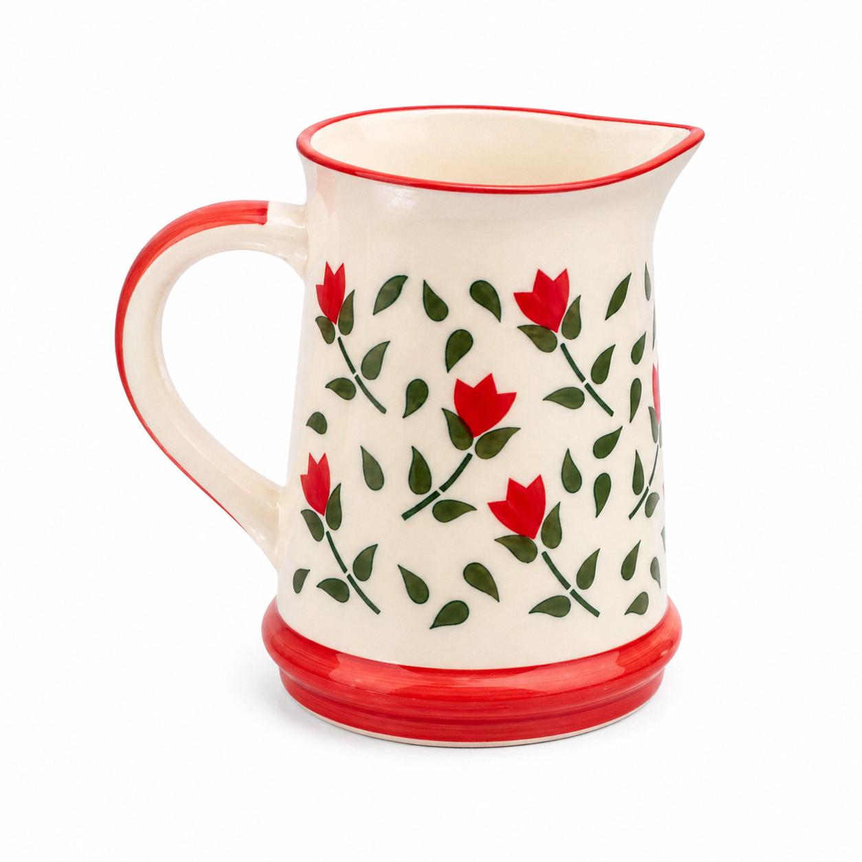 Ceramic pitcher with red floral pattern on a white background