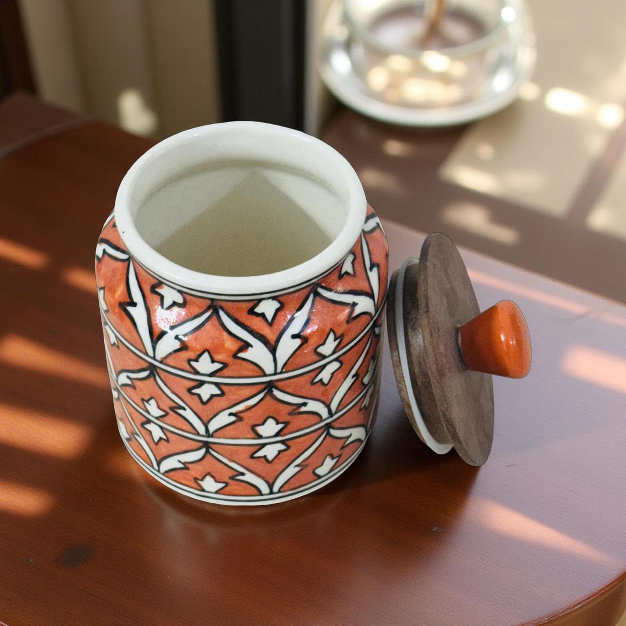 Decorative ceramic jar with a pattern on a wooden surface
