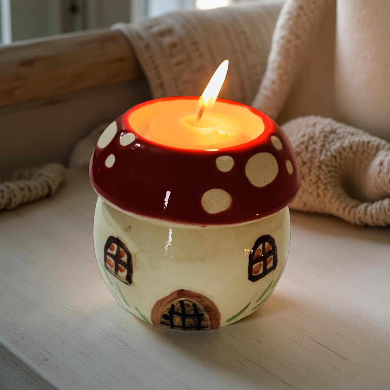 hut shape ceramic candle  t light holder kept on a wooden bench