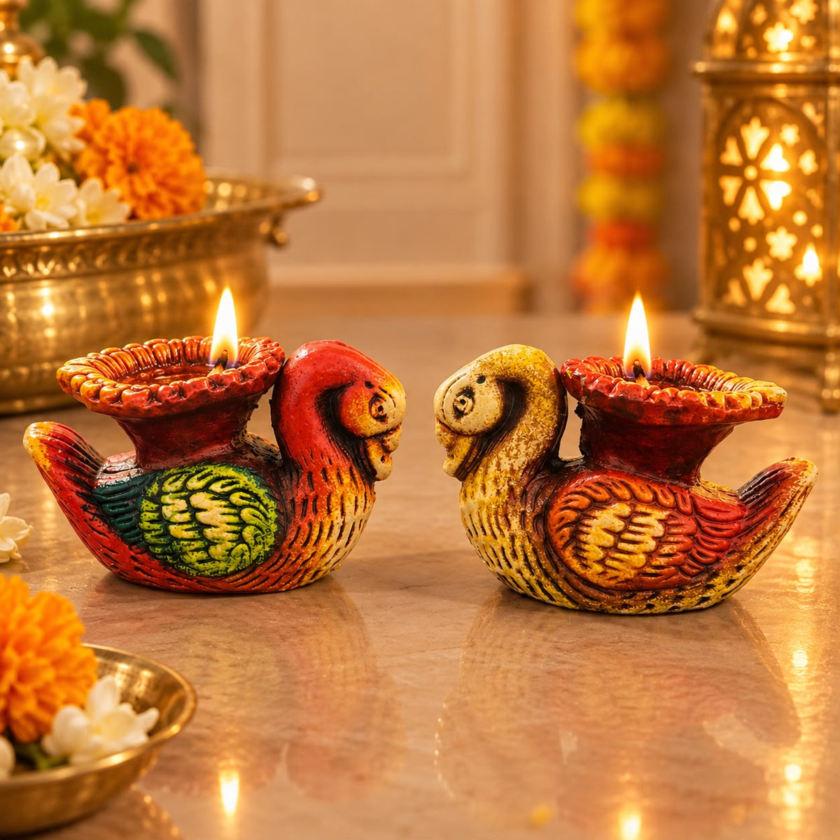 Colourful bird shaped diya set of two with lit lamps