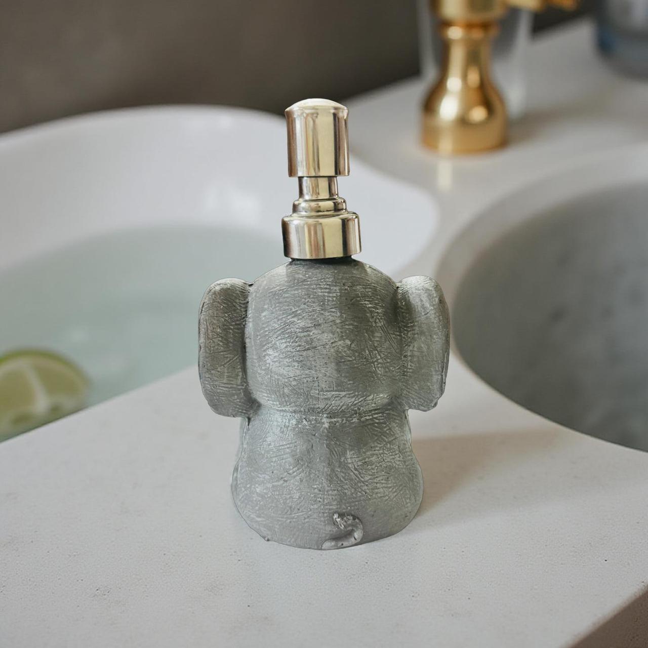 Decorative soap dispenser shaped like a character on a bathroom counter.