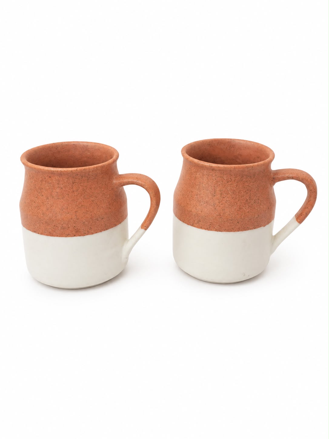 Two ceramic mugs with a terracotta orange-brown upper half and a white lower half, shown on a clean white background.