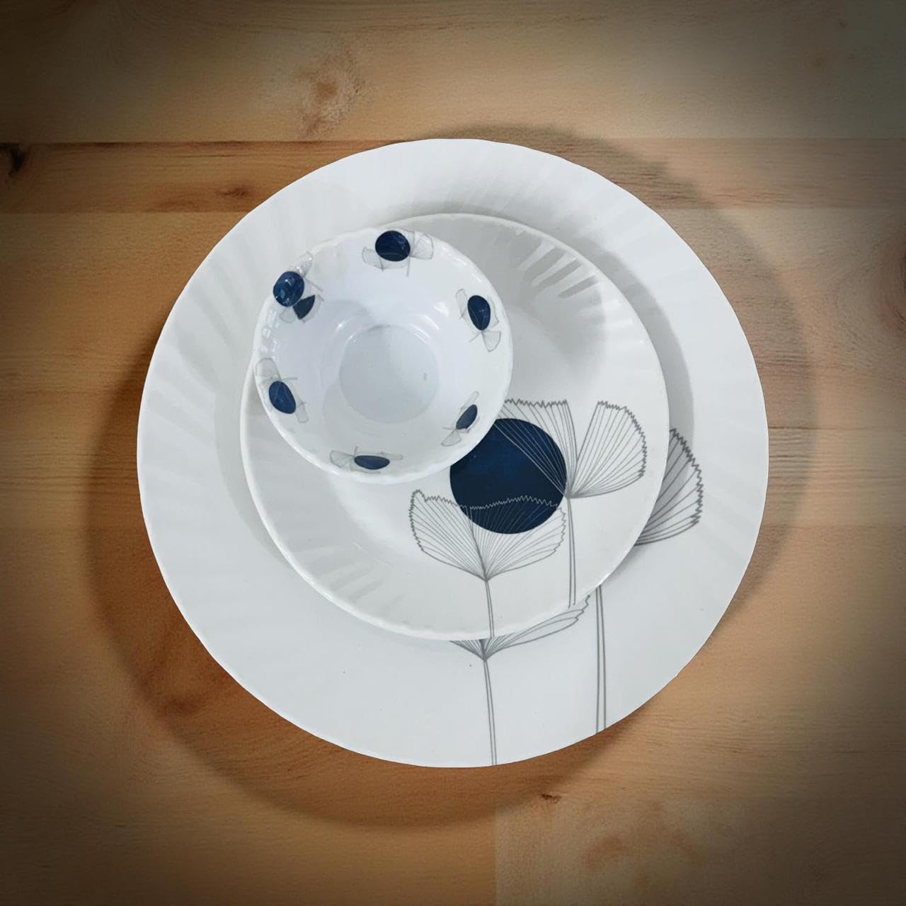 White ceramic dish with blue accents on a wooden surface