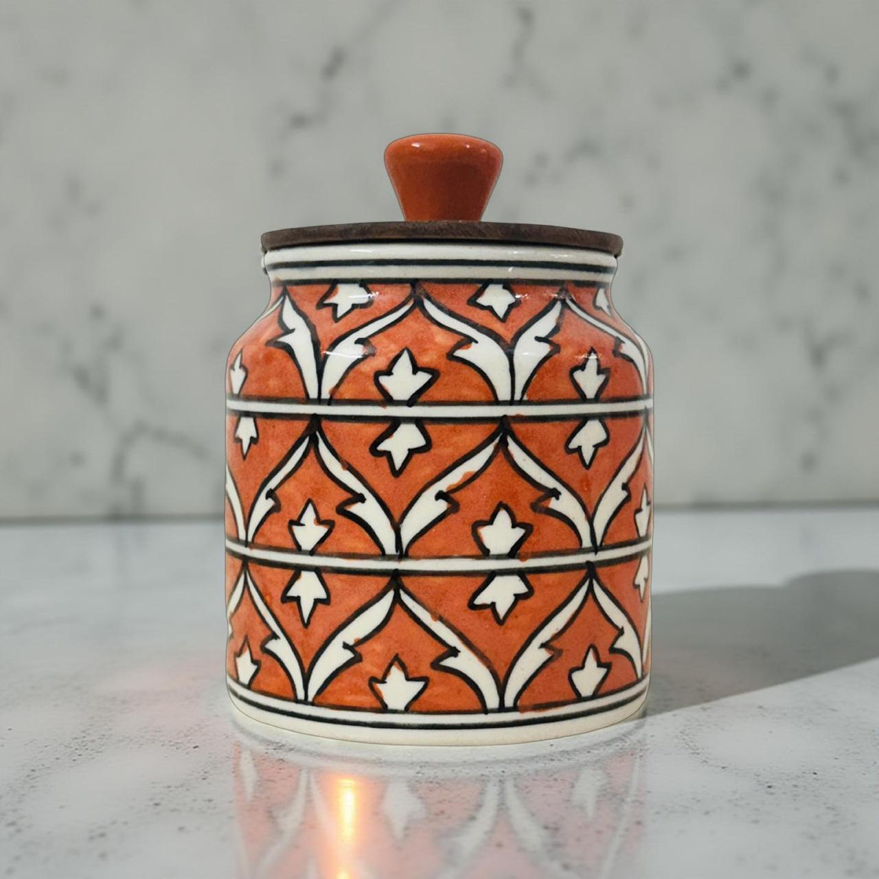 Ceramic jar with decorative patterns on a marble surface