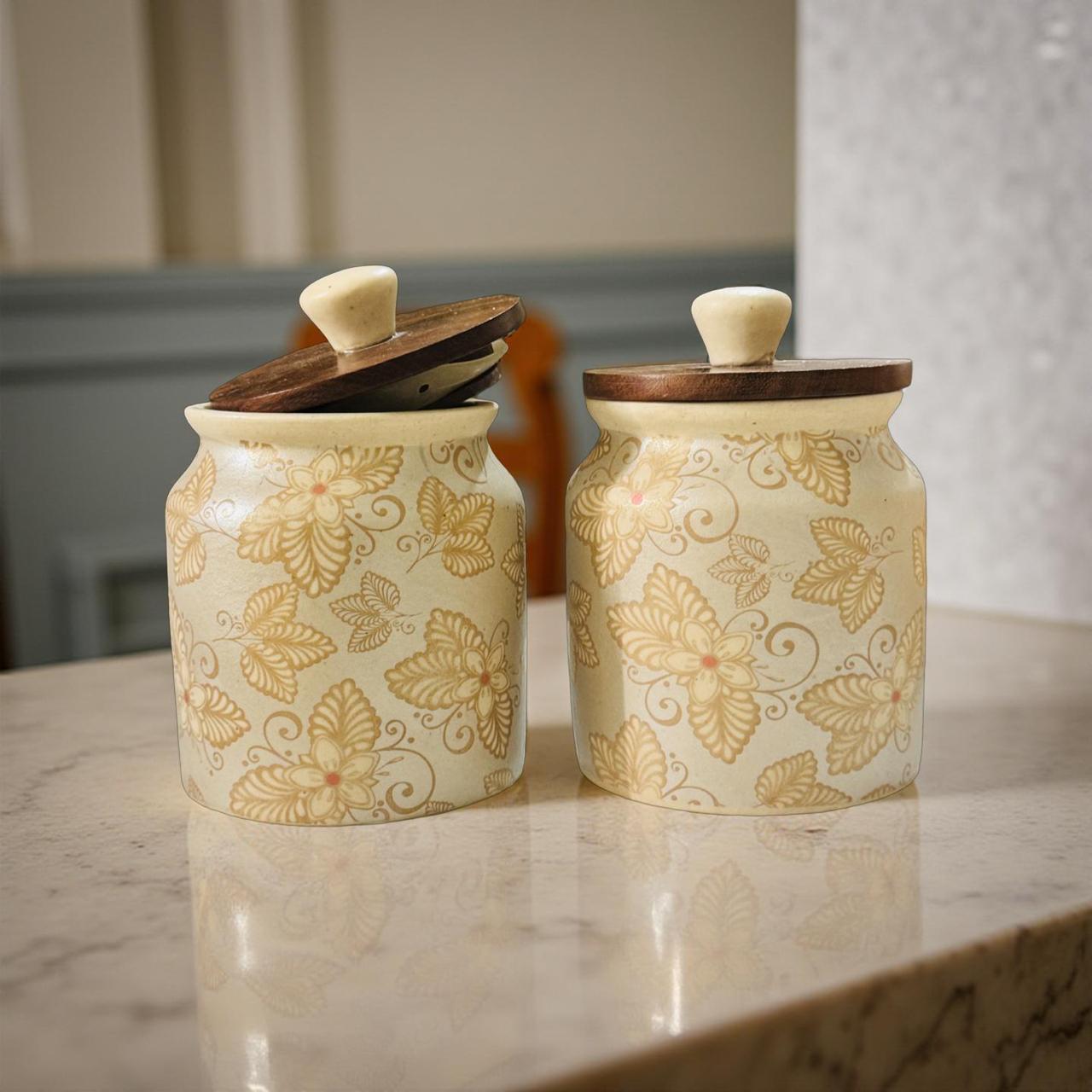 Handcrafted pastel ceramic jar set with floral design and wooden lids by Lupaava, ideal for kitchen decor and gifting.