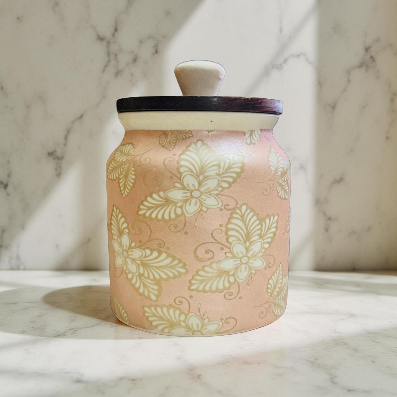 pastel pink jar with white flowers on a marble background
