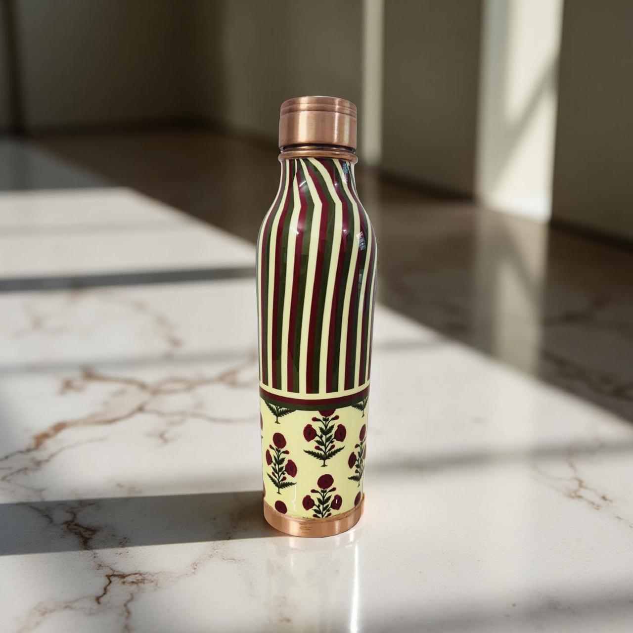 Designer copper bottle featuring contemporary folk-inspired artwork for daily hydration
